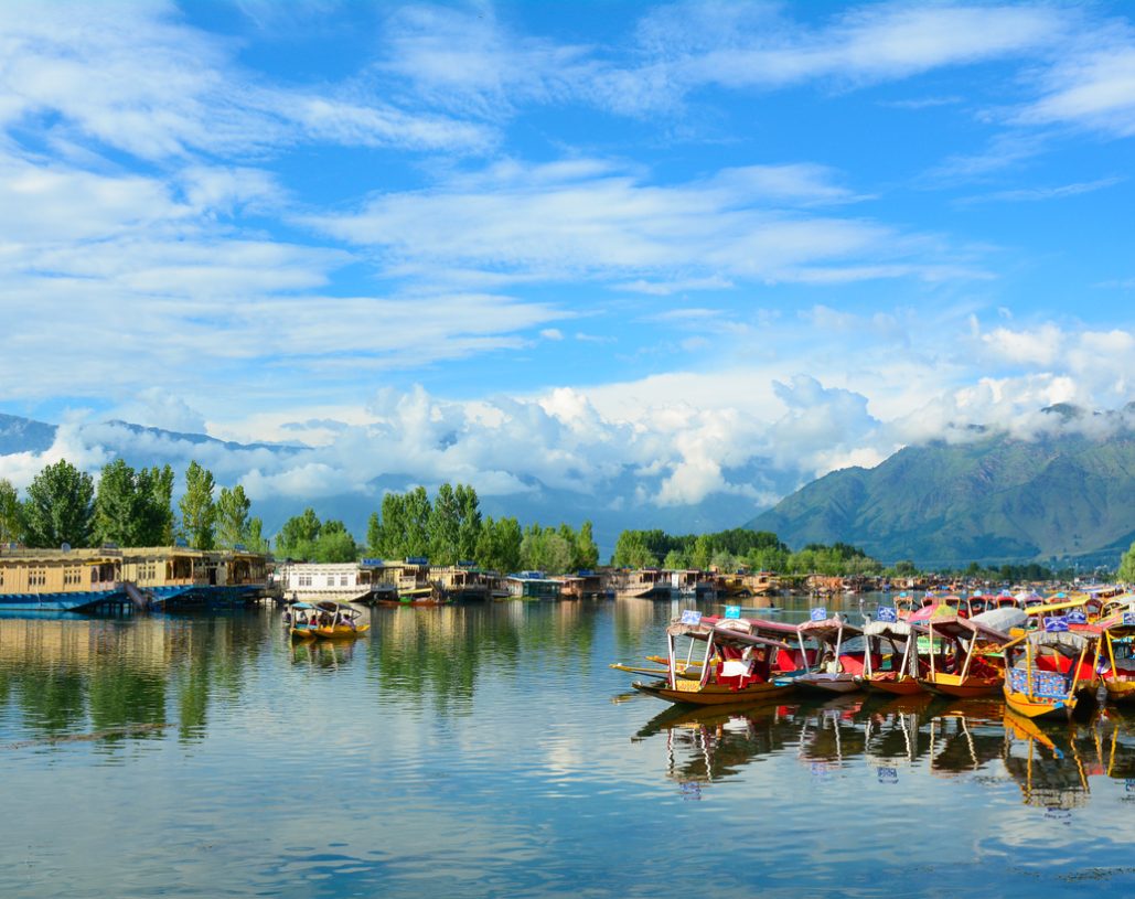 Srinagar, India - July 23, 2015: Many traditional boats waiting for tourists in the Dal lake of Srinagar, Jammu and Kashmir, India. Dal lake is integral to tourism and recreation in Kashmir.